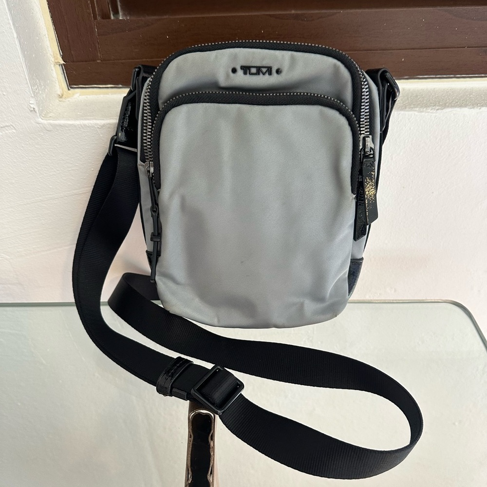 TUMI Ruma gray and black crossbody bag